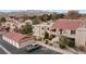 Two-story building complex with red tile roofs, parking, and mountain backdrop at 3810 Desert Marina Dr # 198, Laughlin, NV 89029