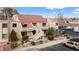 Two-story building, red tile roof, parking lot, and surrounding landscape at 3810 Desert Marina Dr # 198, Laughlin, NV 89029