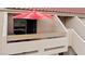 Private patio with red umbrella and seating at 3810 Desert Marina Dr # 198, Laughlin, NV 89029