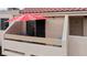 Private patio with red umbrella and seating at 3810 Desert Marina Dr # 198, Laughlin, NV 89029