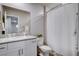 Bathroom showcasing a granite countertop vanity and a shower with a crisp, white curtain at 3812 Seyfert Ave, North Las Vegas, NV 89084