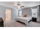 Main bedroom with carpet, ceiling fan, and two windows at 3812 Seyfert Ave, North Las Vegas, NV 89084