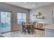 Cozy dining area featuring backyard views and stylish shelving adjacent to the modern kitchen at 3812 Seyfert Ave, North Las Vegas, NV 89084