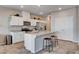 Modern kitchen with stainless steel appliances, granite countertops, and a center island with barstool seating at 3812 Seyfert Ave, North Las Vegas, NV 89084