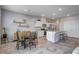 Open-concept kitchen and dining area featuring stainless steel appliances, an island, and a bright, inviting space at 3812 Seyfert Ave, North Las Vegas, NV 89084