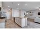 Spacious kitchen and living area featuring an island with granite countertops and stainless steel appliances at 3812 Seyfert Ave, North Las Vegas, NV 89084