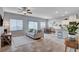 Open concept living room with ample natural light, sleek tile flooring, and comfortable seating at 3812 Seyfert Ave, North Las Vegas, NV 89084