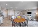 Open-concept living and dining area featuring a modern kitchen island and inviting living space at 3812 Seyfert Ave, North Las Vegas, NV 89084