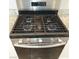 Close-up of the stainless steel Whirlpool gas stove with four burners at 3812 Seyfert Ave, North Las Vegas, NV 89084