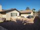 Backyard view of home, gravel and storage at 3867 Jewel Ave, Las Vegas, NV 89121