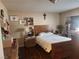 Main bedroom with wood floors and large bed at 3867 Jewel Ave, Las Vegas, NV 89121