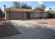 Ranch style home with attached garage and driveway at 3867 Jewel Ave, Las Vegas, NV 89121