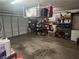 Spacious garage with overhead storage and shelving units at 3867 Jewel Ave, Las Vegas, NV 89121