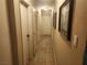 Long hallway with several doors and wall decor at 3867 Jewel Ave, Las Vegas, NV 89121