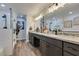 Elegant bathroom with double vanity, granite countertop, and large shower at 390 Peaceful St, Las Vegas, NV 89110