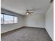 Spacious bedroom with carpeted floor and large window at 390 Peaceful St, Las Vegas, NV 89110