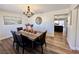 Bright dining room with wood table, chandelier, and hardwood floors at 390 Peaceful St, Las Vegas, NV 89110