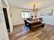 Elegant dining room featuring a wood table and bench with hardwood floors at 390 Peaceful St, Las Vegas, NV 89110