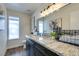 Bathroom with granite countertop and dark vanity at 3981 Ebro Way, Las Vegas, NV 89103