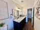 Bathroom with granite countertop and dark vanity at 3981 Ebro Way, Las Vegas, NV 89103