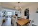 Elegant dining room with a farmhouse table and chandelier at 3981 Ebro Way, Las Vegas, NV 89103