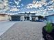 Updated home exterior boasts a two-car garage and modern curb appeal at 3981 Ebro Way, Las Vegas, NV 89103