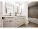 Modern bathroom with double vanity, updated fixtures, and a soaking tub at 4016 Tyler William Ln, Las Vegas, NV 89130