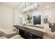 Elegant dining room with a statement chandelier and modern table at 4016 Tyler William Ln, Las Vegas, NV 89130