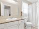 Bathroom featuring granite counters, a large mirror and white cabinets at 4248 Tolkien Ave, Las Vegas, NV 89115