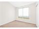 Neutral bedroom featuring carpet flooring and a large window at 4248 Tolkien Ave, Las Vegas, NV 89115