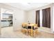 Cozy dining area adjacent to the kitchen featuring tile flooring and natural light at 4248 Tolkien Ave, Las Vegas, NV 89115