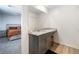 Modern gray vanity with granite countertop in the bathroom at 4904 Siglo St, North Las Vegas, NV 89031