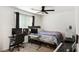 Bedroom with full-size bed, workspace, and piano at 4904 Siglo St, North Las Vegas, NV 89031