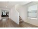 Bright hallway with hardwood floors leading to the living area and upstairs at 4904 Siglo St, North Las Vegas, NV 89031