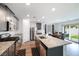 Modern kitchen featuring granite countertops, stainless steel appliances, and an island at 4904 Siglo St, North Las Vegas, NV 89031