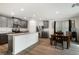 Modern kitchen with grey cabinets, granite countertops, and stainless steel appliances at 4904 Siglo St, North Las Vegas, NV 89031