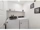 Laundry room with washer, dryer, and shelving at 4904 Siglo St, North Las Vegas, NV 89031