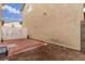 Small backyard with red tile patio and partially fenced area at 531 Dairy Creek Ave, Las Vegas, NV 89183