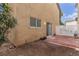 Small backyard with red tile patio and partially fenced area at 531 Dairy Creek Ave, Las Vegas, NV 89183