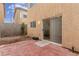 Small backyard with red tile patio and partially fenced area at 531 Dairy Creek Ave, Las Vegas, NV 89183