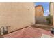 Small backyard with red tile patio and partially fenced area at 531 Dairy Creek Ave, Las Vegas, NV 89183