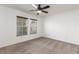 Bright bedroom with carpet, ceiling fan and double closets at 531 Dairy Creek Ave, Las Vegas, NV 89183