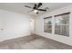 Well-lit bedroom with two windows and ceiling fan at 531 Dairy Creek Ave, Las Vegas, NV 89183