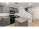 Kitchen with gray cabinets, granite countertops, and island at 531 Dairy Creek Ave, Las Vegas, NV 89183