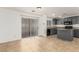 Kitchen with gray cabinets and island, adjacent to living area at 531 Dairy Creek Ave, Las Vegas, NV 89183