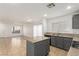 Open concept kitchen with gray cabinets and island at 531 Dairy Creek Ave, Las Vegas, NV 89183