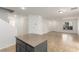 Open living room with tile floors and kitchen island at 531 Dairy Creek Ave, Las Vegas, NV 89183