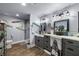 Modern bathroom with gray vanity, shower, and stylish lighting at 5521 Money St, Pahrump, NV 89048