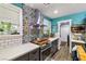 Bright kitchen with white subway tile backsplash and unique patterned tile at 5521 Money St, Pahrump, NV 89048