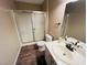 Updated bathroom with shower, toilet, and vanity at 5710 E Tropicana Ave # 2122, Las Vegas, NV 89122